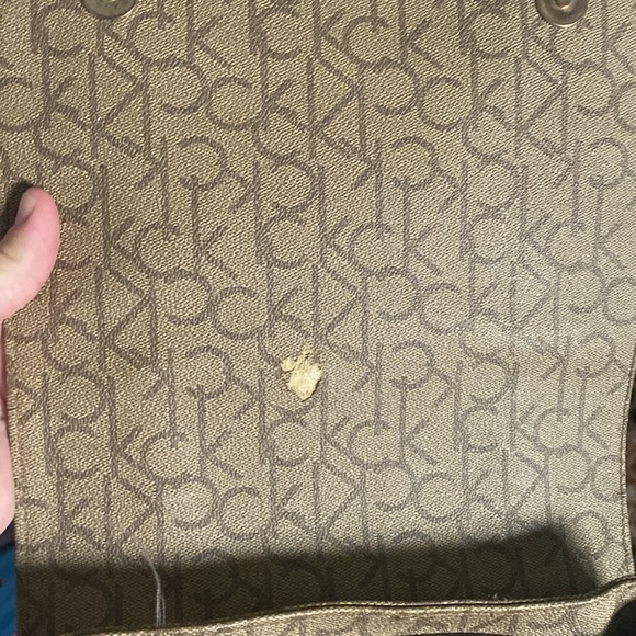 Calvin Klein backpack, is burgundy and dark beige. And in good condition